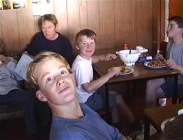 Fergus, Alasdair and Kieron enjoy home-cooked food at Raasay YH